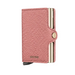 A pink pebbled leather Secrid Mini wallet with gold-tone metal accents and a snap-button closure, shown on a clean white background.