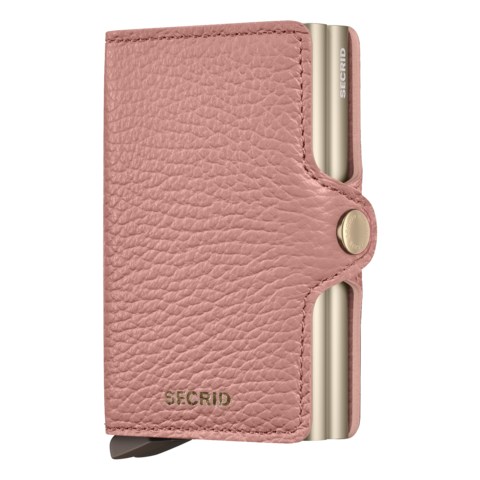 A pink leather Secrid Twin Wallet with a metallic clasp, embossed with the brand's logo.