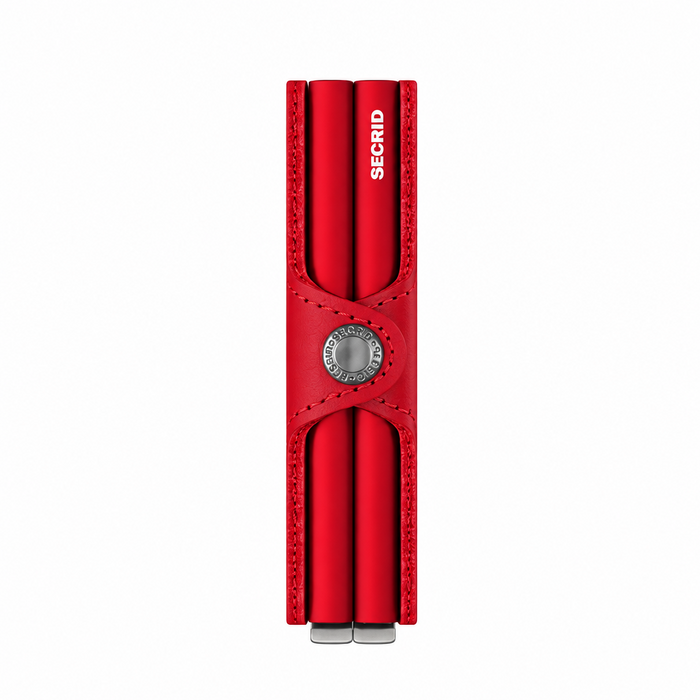 The side view of a red Secrid Twin Wallet  shown closed, featuring two card protectors slots and a snap button in the center. The brand name 'SECRID' is printed vertically on the right card holder.