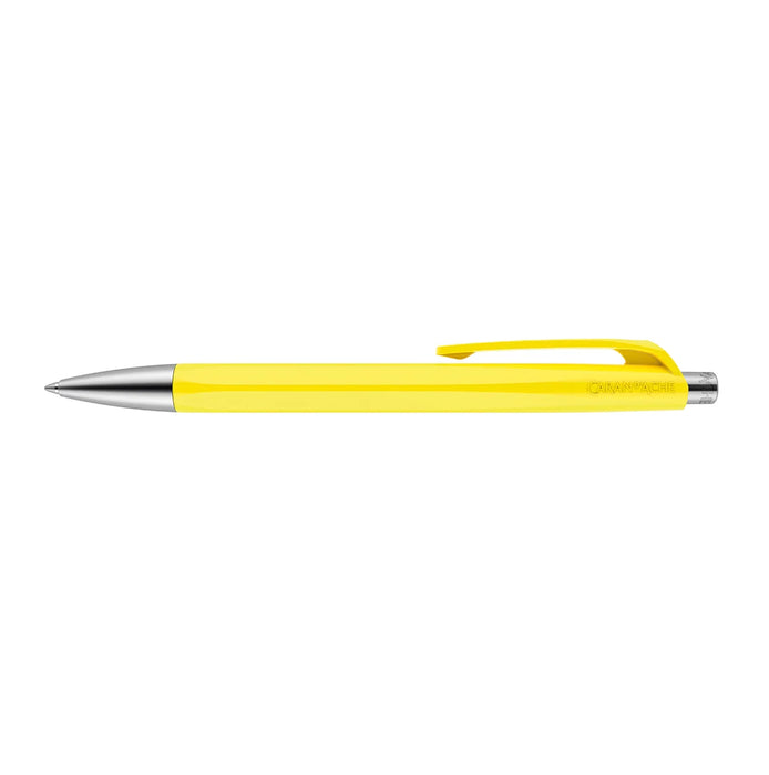 A bright yellow Caran d'Ache 888 Infinite retractable ballpoint  pen with metal fittings and flexible clip. Ident No. Caran d'Ache 888.240