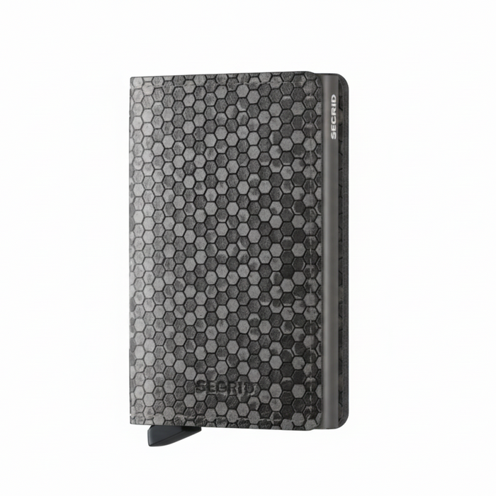 A slim, grey Secrid wallet with a hexagon pattern on the front.