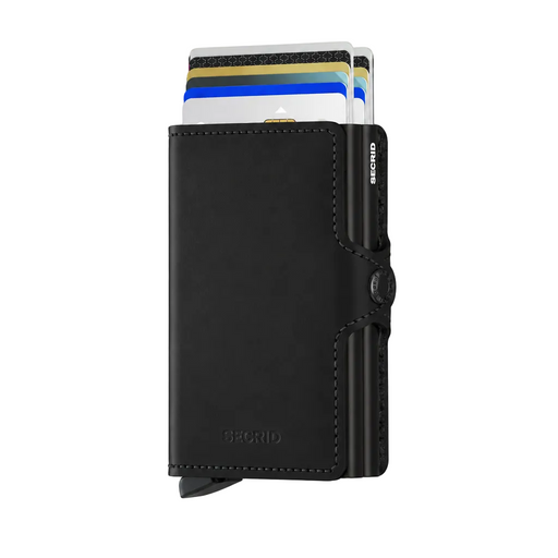 A black leather cardholder Secrid wallet with a sliding card mechanism, shown with several cards partially inserted. The wallet features a snap-button closure, visible stitching, and the brand name 'SECRID' debossed on the lower front.