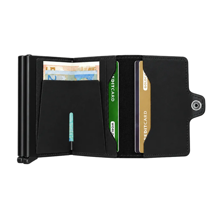 A black leather Secrid wallet shown open, displaying multiple card slots filled with cards and cash.