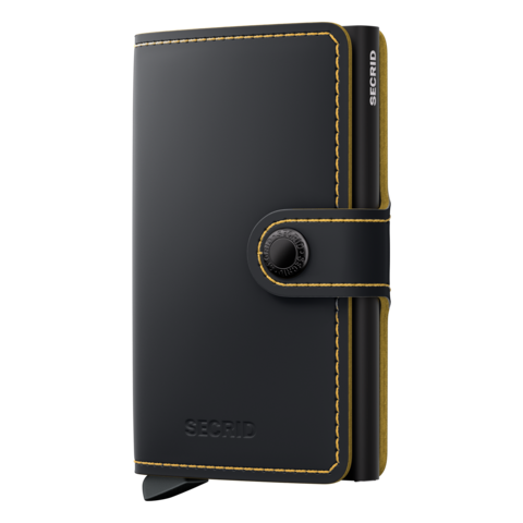 A matte black Secrid mini wallet with an ochre (golden) border and a card protector mechanism visible on the side.