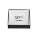 Montblanc cufflinks in a black and white box on a light gray background