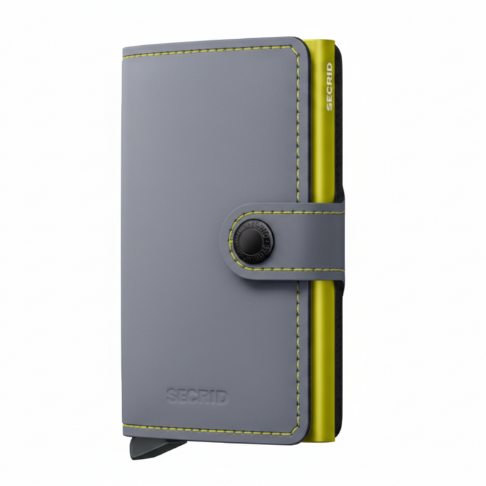 A gray leather wallet with a bright yellow-green side accent and matching contrast stitching, featuring a snap-button strap closure and the SECRID logo, shown on a plain white background.