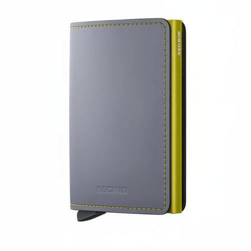 A Secrid minimalist metal wallet in gray with bright yellow-green stitching and a matching yellow-green side frame, shown on a plain white background.