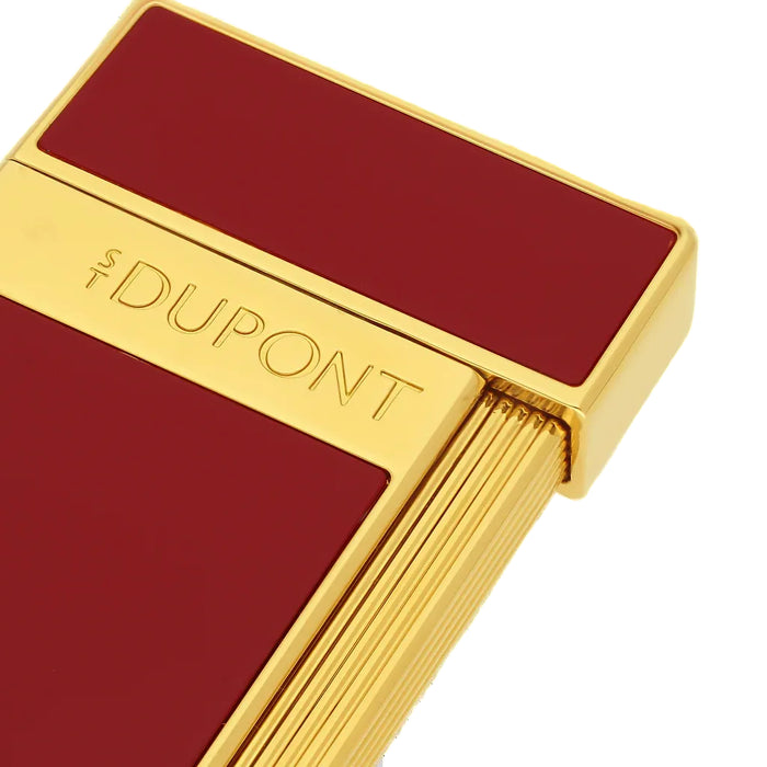 A close up of a  deep red with gold accents S. T. Dupont lighter. A premium  torch-flame lighter, perfect for cigar smoking. Model 028030