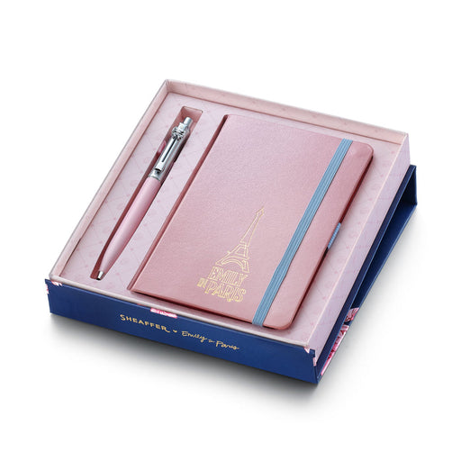 Sheaffer Gift Set Emily in Paris featuring a matte pink ballpoint pen with polished chrome cap and trim and small hardbound notebook embossed with the Eiffel Tower emblem. Model G232151-4
