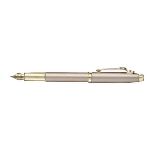 A sleek Sheaffer 100  Emily in Paris fountain pen in a metallic champagne gold lacquer finish with champagne gold  trims and adorned with a bow-shaped emblem on the clip . Model E0937753